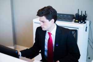 a security agent behind a desk